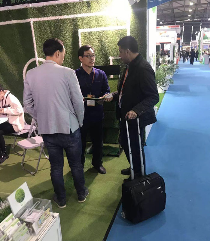 Our Boss and Manager Is Talking with the Customer on the Exhibition